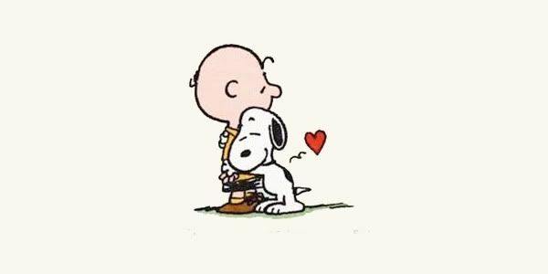 Snoopy hugs Charlie Brown
